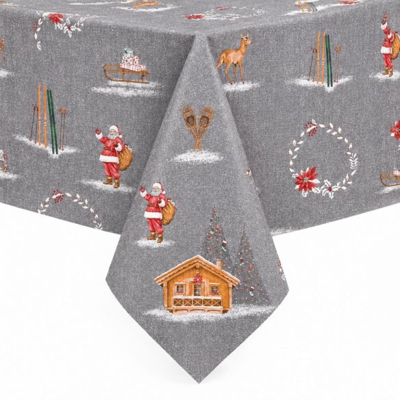Grijs tafelzeil Christmas Chalet met kerstmotieven zoals de Kerstman, een houten berghut, ski's en herten, strak over een tafel gedrapeerd.