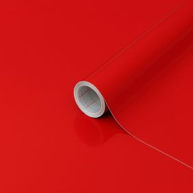 Volle rol plakfolie in uni rood glossy, 45cm breed en 15m lang, ideaal voor tafelbescherming.